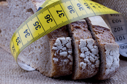 Measuring tape wrapped around slices of bread