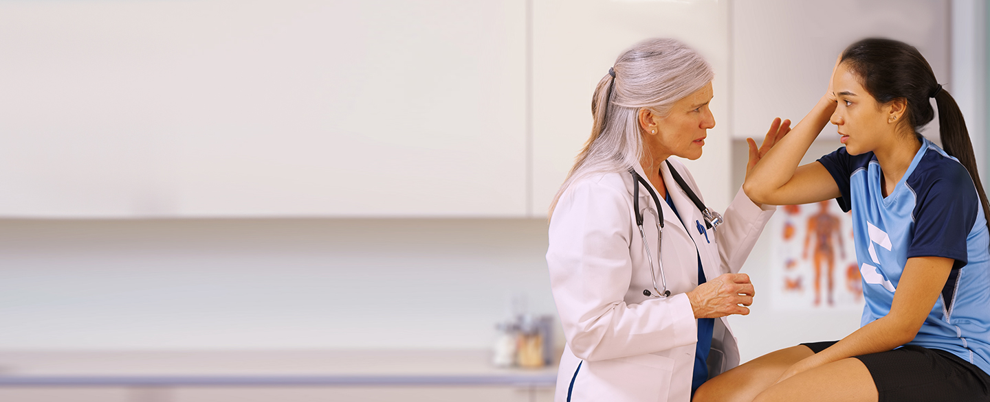 Doctor treating an athlete's concussion.