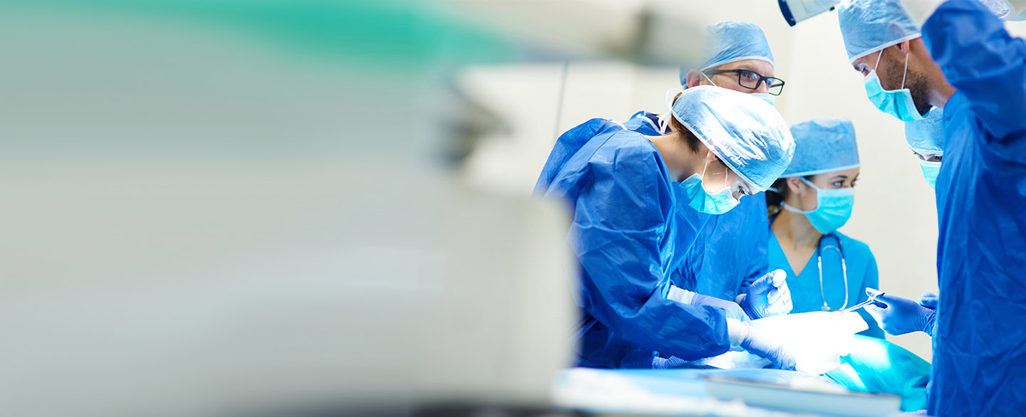 Surgeons operating on patient.