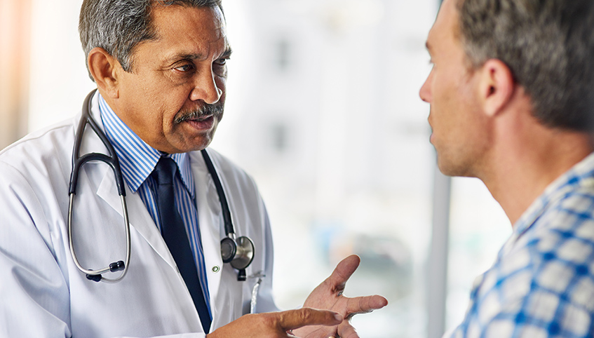 Doctor talking with patient