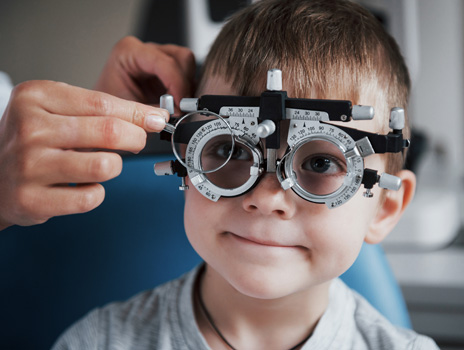 Child taking an ophthalmic exam