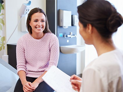 Doctor visiting with patient.