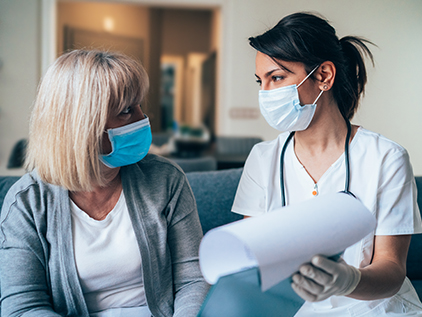 Doctor visiting with patient.