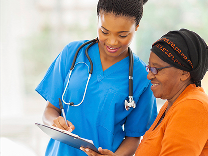 Nurse and patient going over their chart.