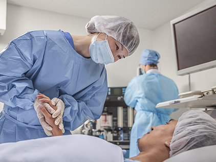 Surgeon talking with patient.