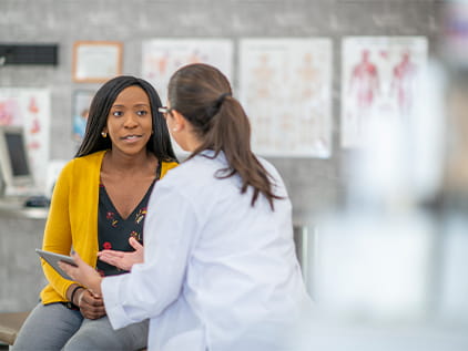 Woman speaking with her doctor