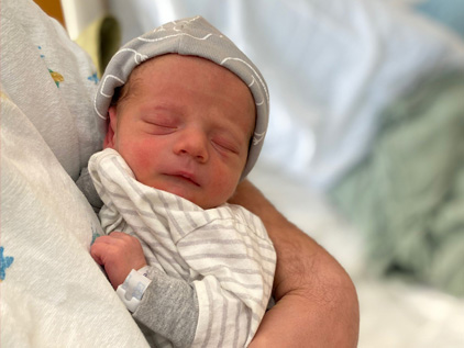 New born baby held by mother, Kara Armato
