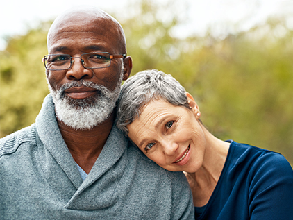 Diverse couple smiling.