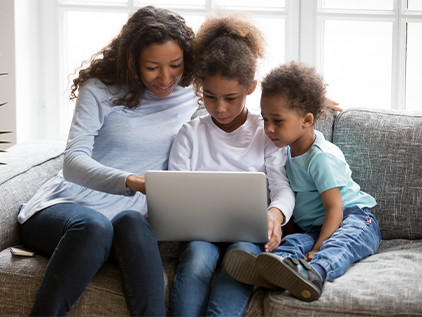 Mother and children on computer
