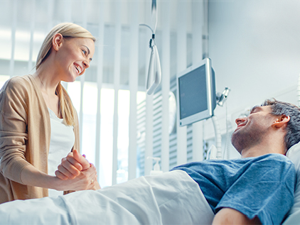 Woman visiting her husband in the hospital.