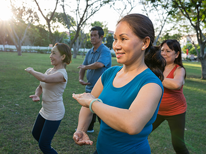 Group of people doing tai chi.