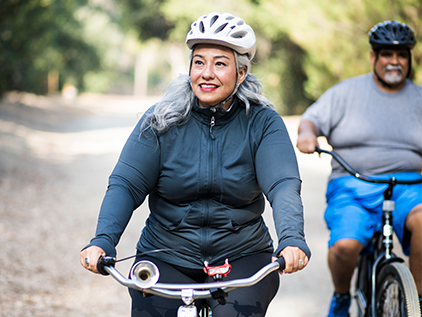 Woman and man biking
