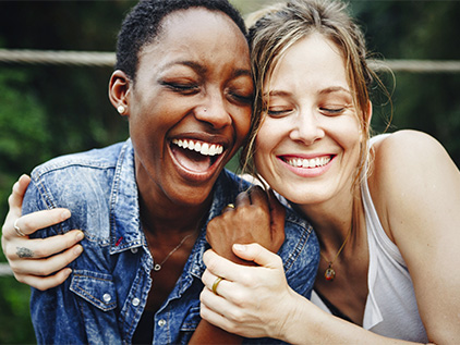 Happy women embracing