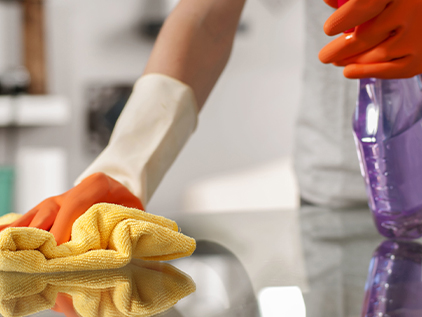 Person cleaning counter