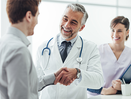 Doctor shaking patient's hand.