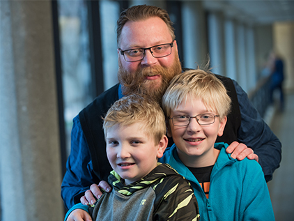 Heart patient John Findlay with his two sons.