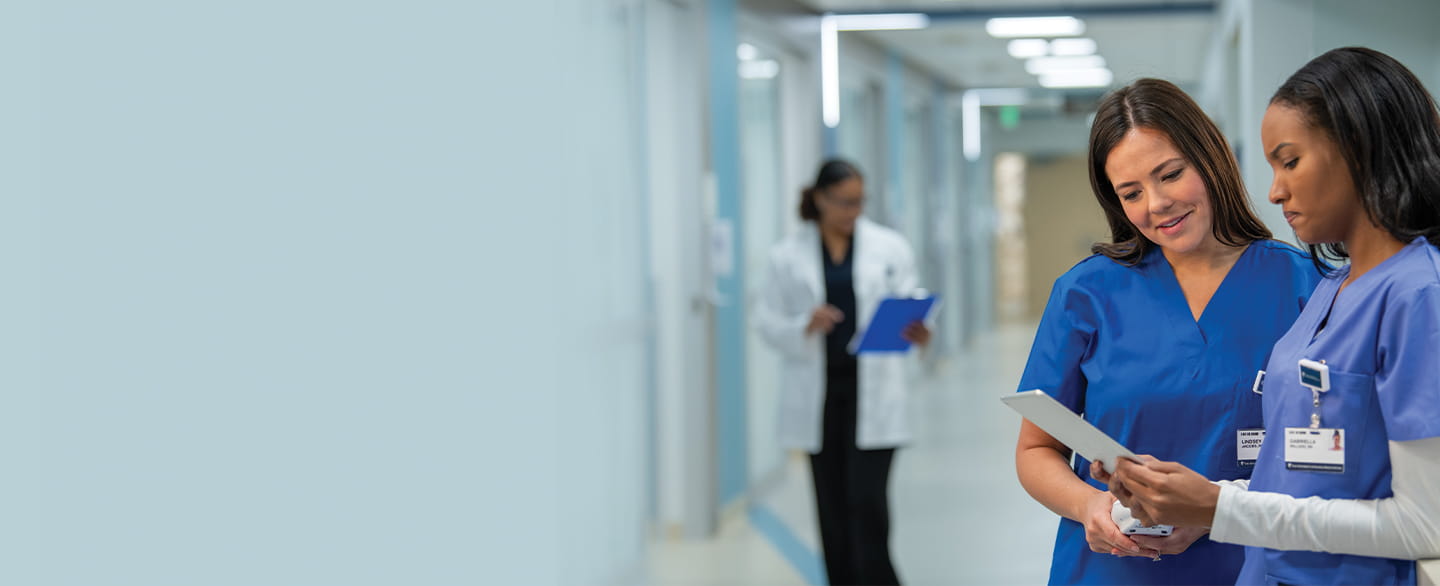 Nurses looking over paperwork