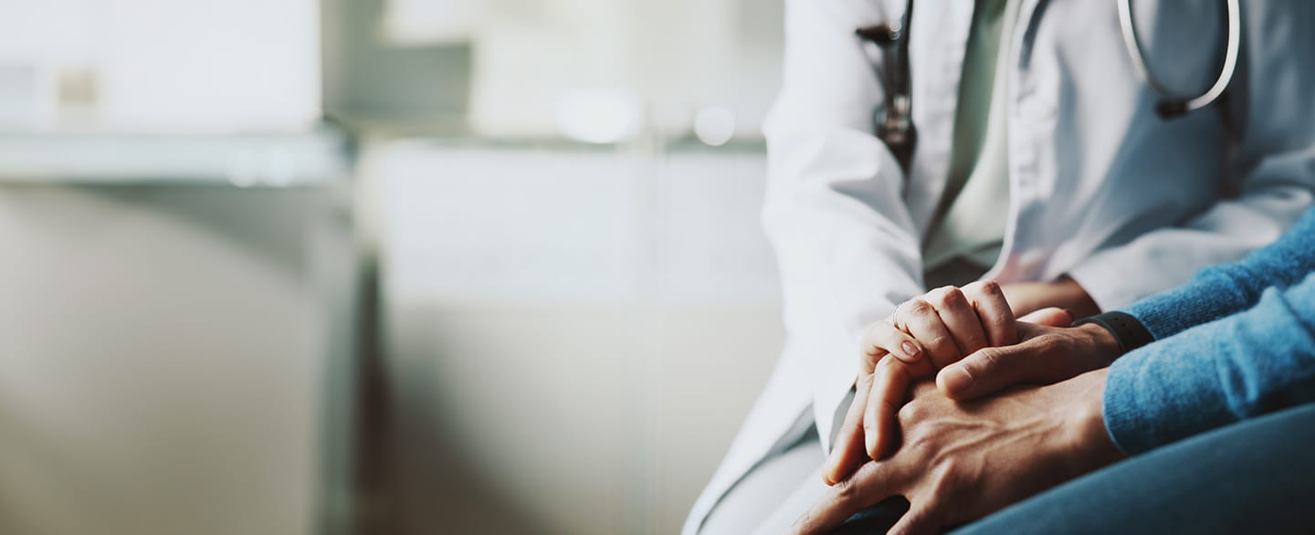 Doctor holding a patient hand