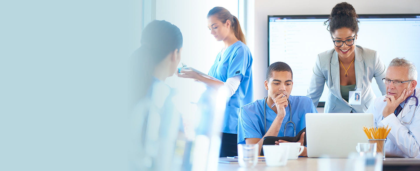 Vendor visiting with a nurse and physician.