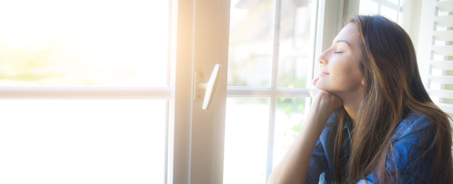 Woman looking out of the window