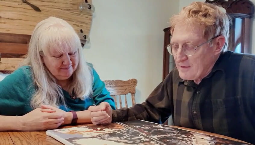 Brian and wife at table painting