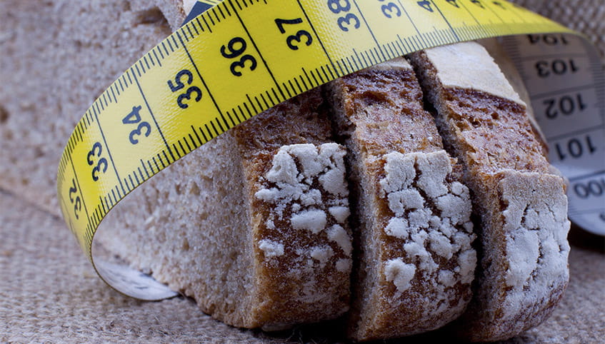 Tape measure wrapped around sliced bread.