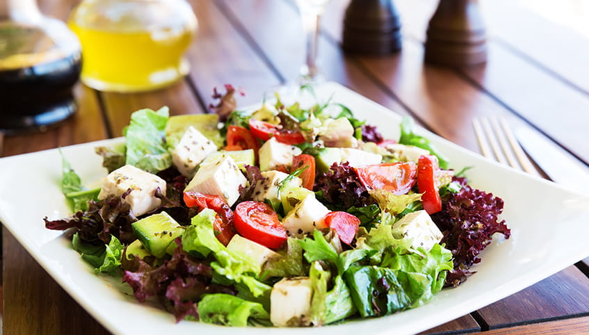 Salad with feta, tomatoes and avocado.