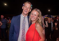 man and woman smiling at camera