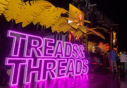 treads and threads neon sign