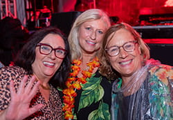 women smiling at the camera