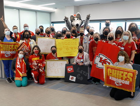 Photo of our employees wearing Chiefs gear