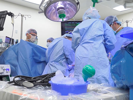 Photo of surgeons performing quadruple transplant in OR