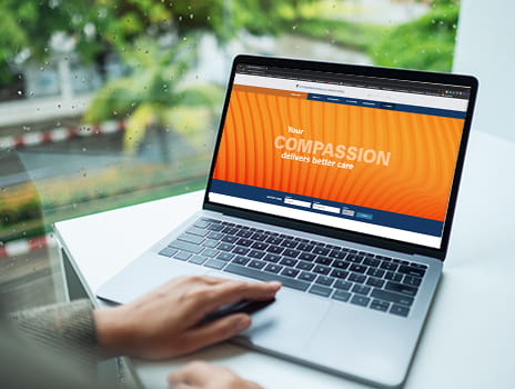 Person on computer searching for a job at The University of Kansas Health System