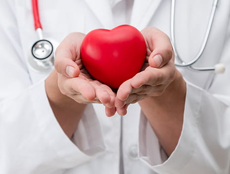 Dr. holding a foam heart