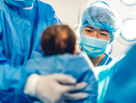 Midwife nurse delivers baby