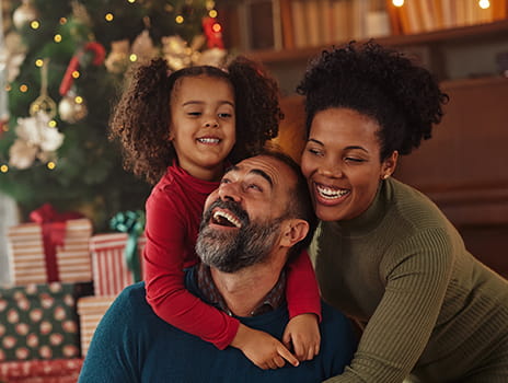 Family laughing together at Christmas