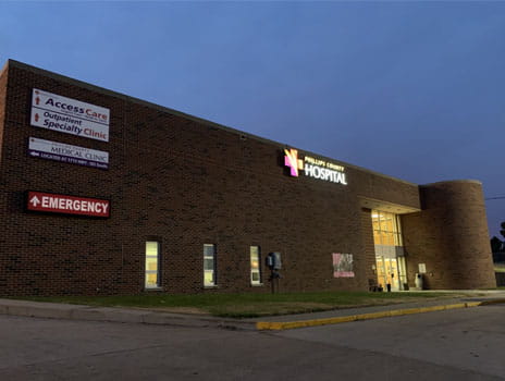 Phillips County Health System building at night.