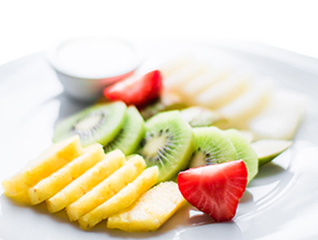Sliced fruit on a plate.