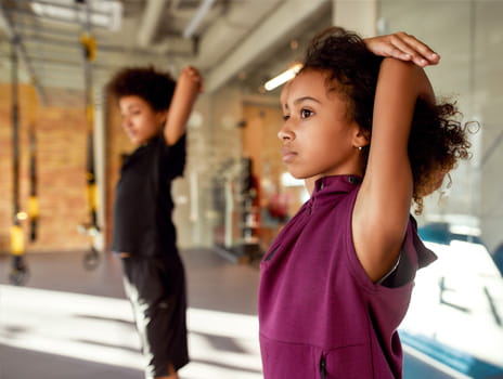 Kids stretching before sports training
