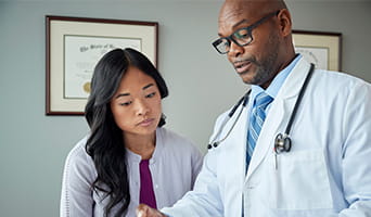 Doctor speaking with patient