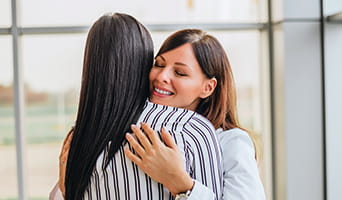Doctor hugging a patient