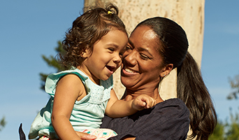 Smiling mother and daughter