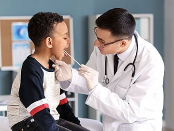 Doctor examining child patient