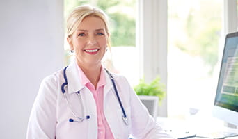 Female doctor smiling.