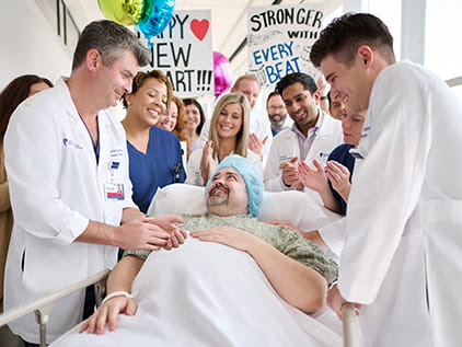 Doctors with a heart transplant patient