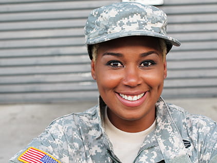 Military veteran smiling.