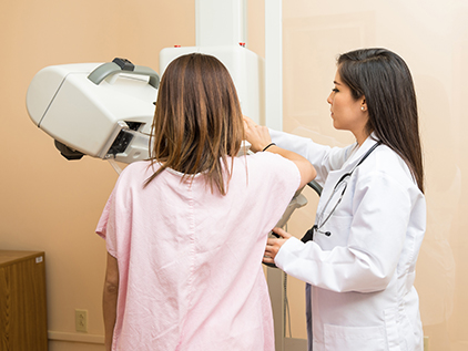 Woman getting a mammogram.