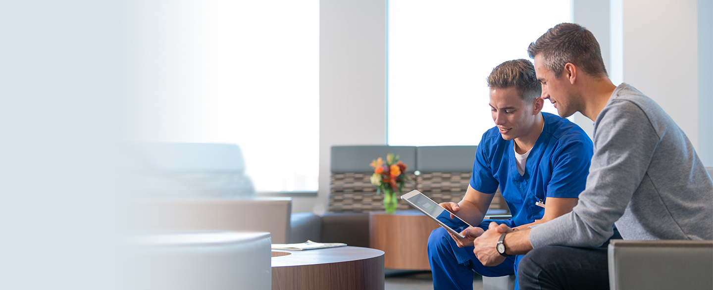 Nurse showing patient how to use MyChart.